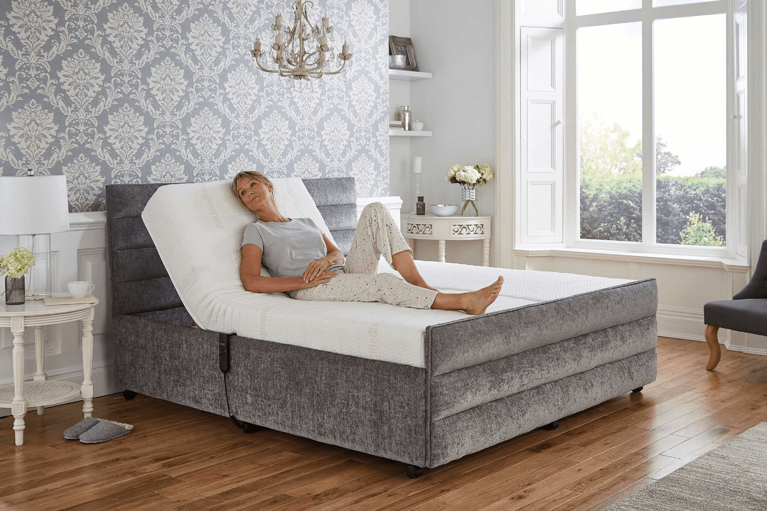 Woman reclining on an Oak Tree Mobility Adjustable Bed