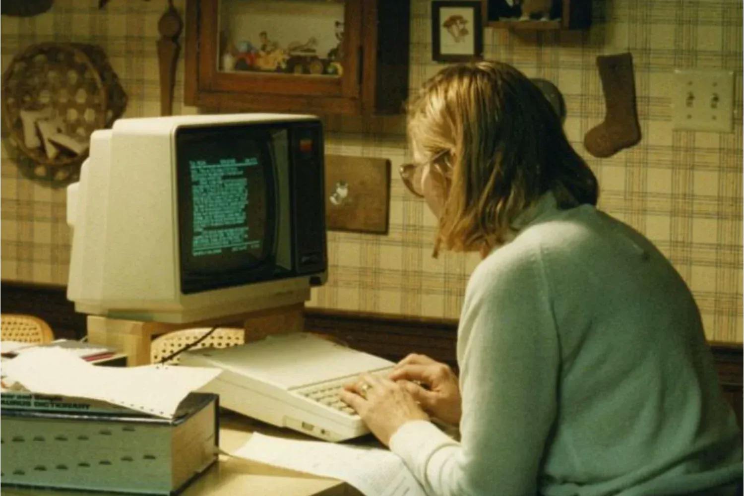 Woman on an old computer