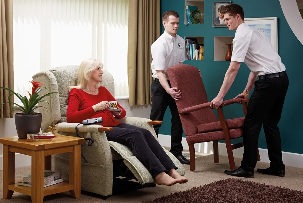 Oak Tree staff removing customer's old chair