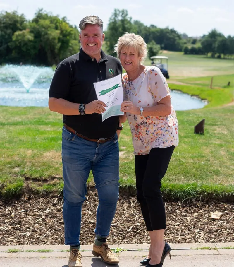 Sam Shann and representative holding certificate 2