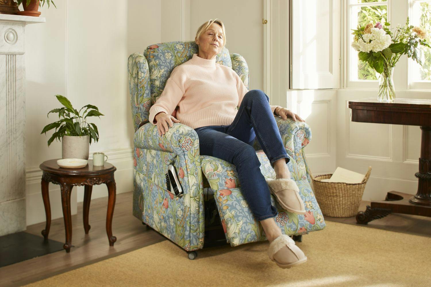 woman with her feet up reclining and relaxing on a Morris & Co. Oak Tree Mobility rise and recline chair.
