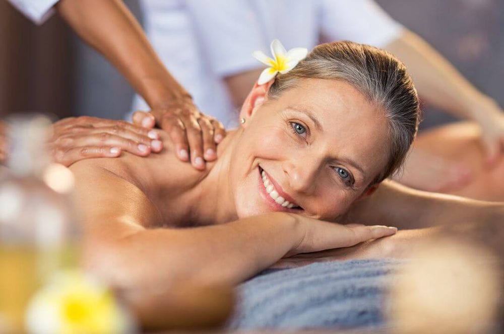 Elderly woman having a massage