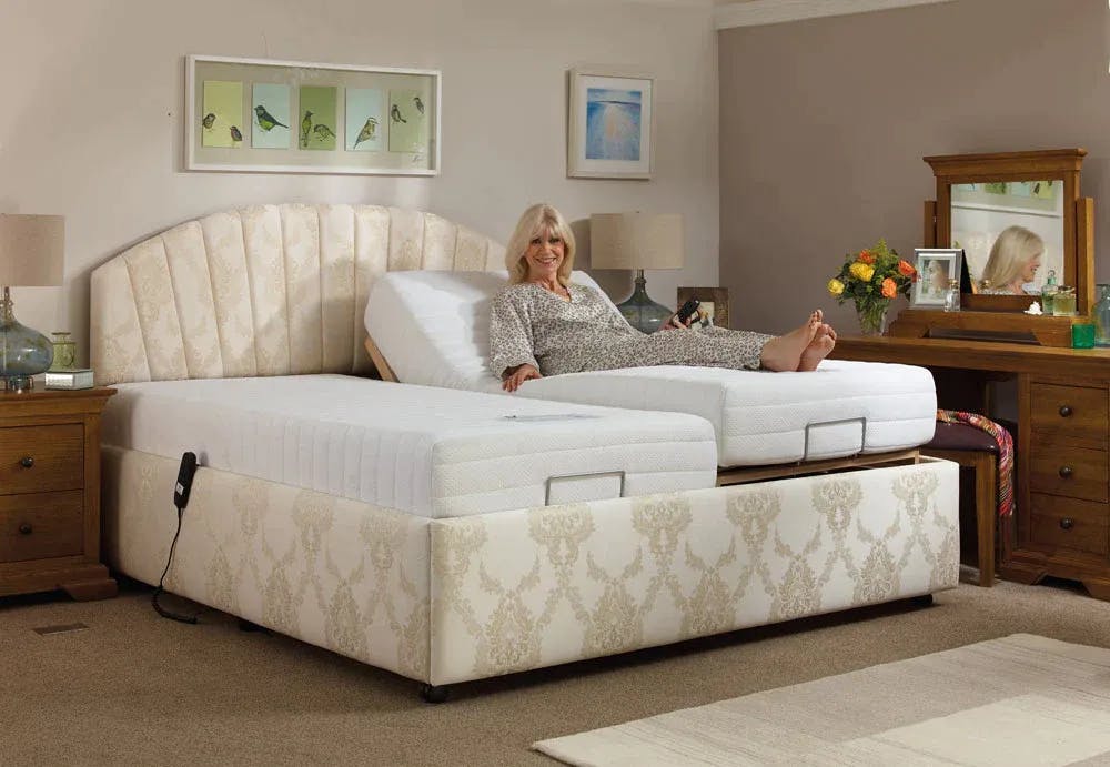 Woman lying on a dual adjustable beds