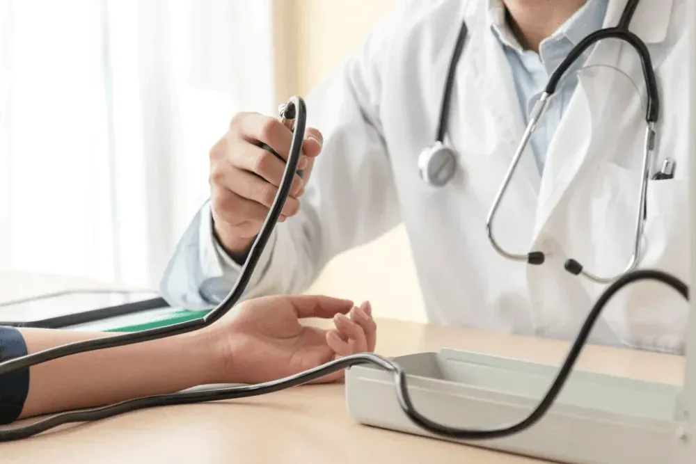 Doctor testing blood pressure
