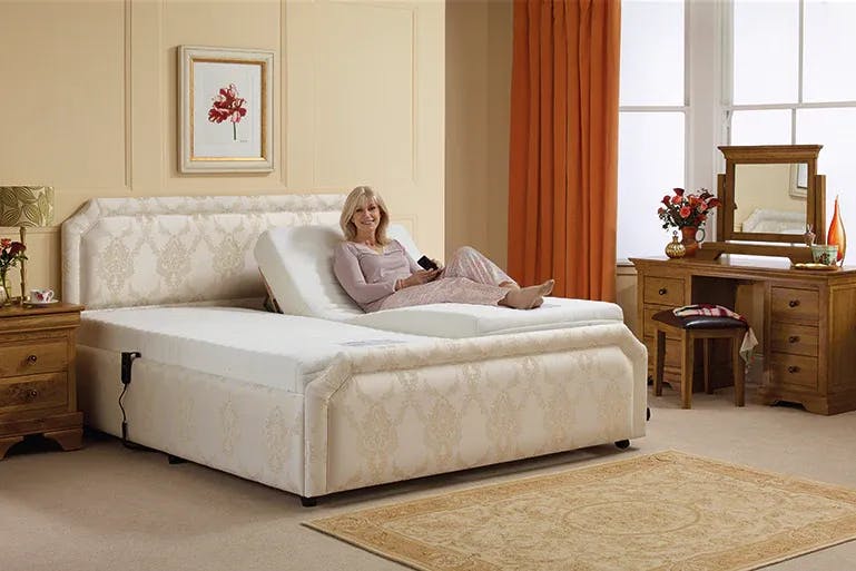 Lady sitting on double reclining bed