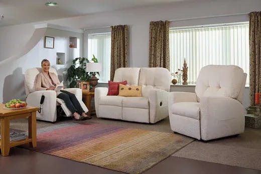 Woman sitting in living room on Rise and Recline Chair