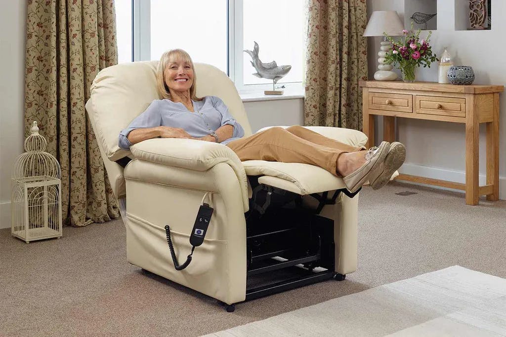 Elderly woman sitting on a chair that's reclined