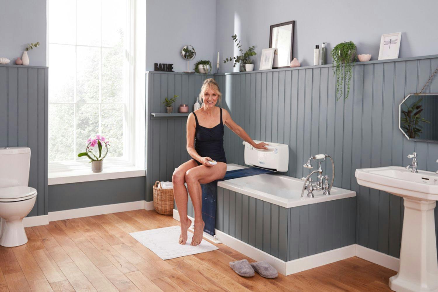 Image showing woman sitting on her bath lift.