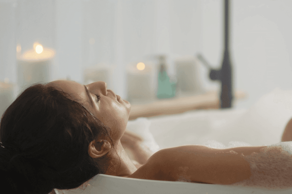 Photo showing a woman relaxing in bath