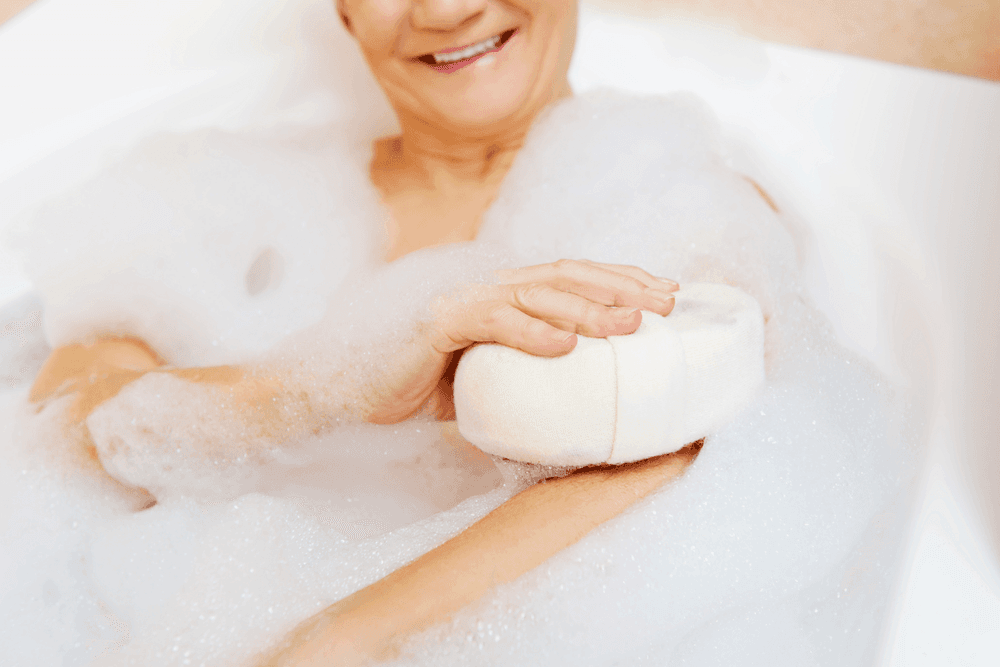 Woman in bathtub bathing