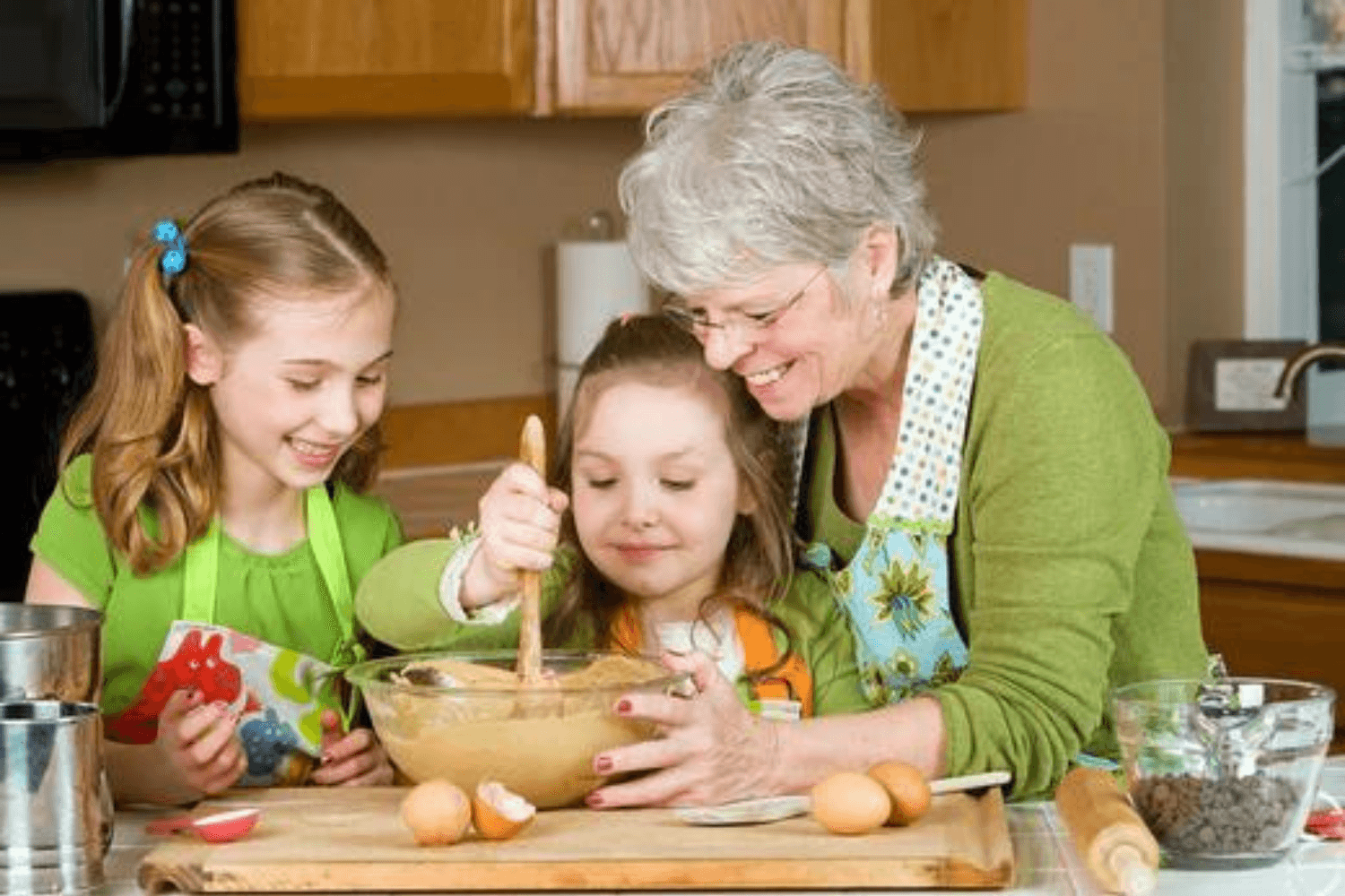 Children with grandma baking