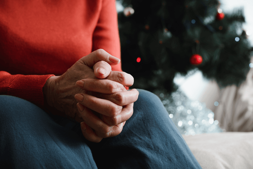 Elderly lady alone at Christmas