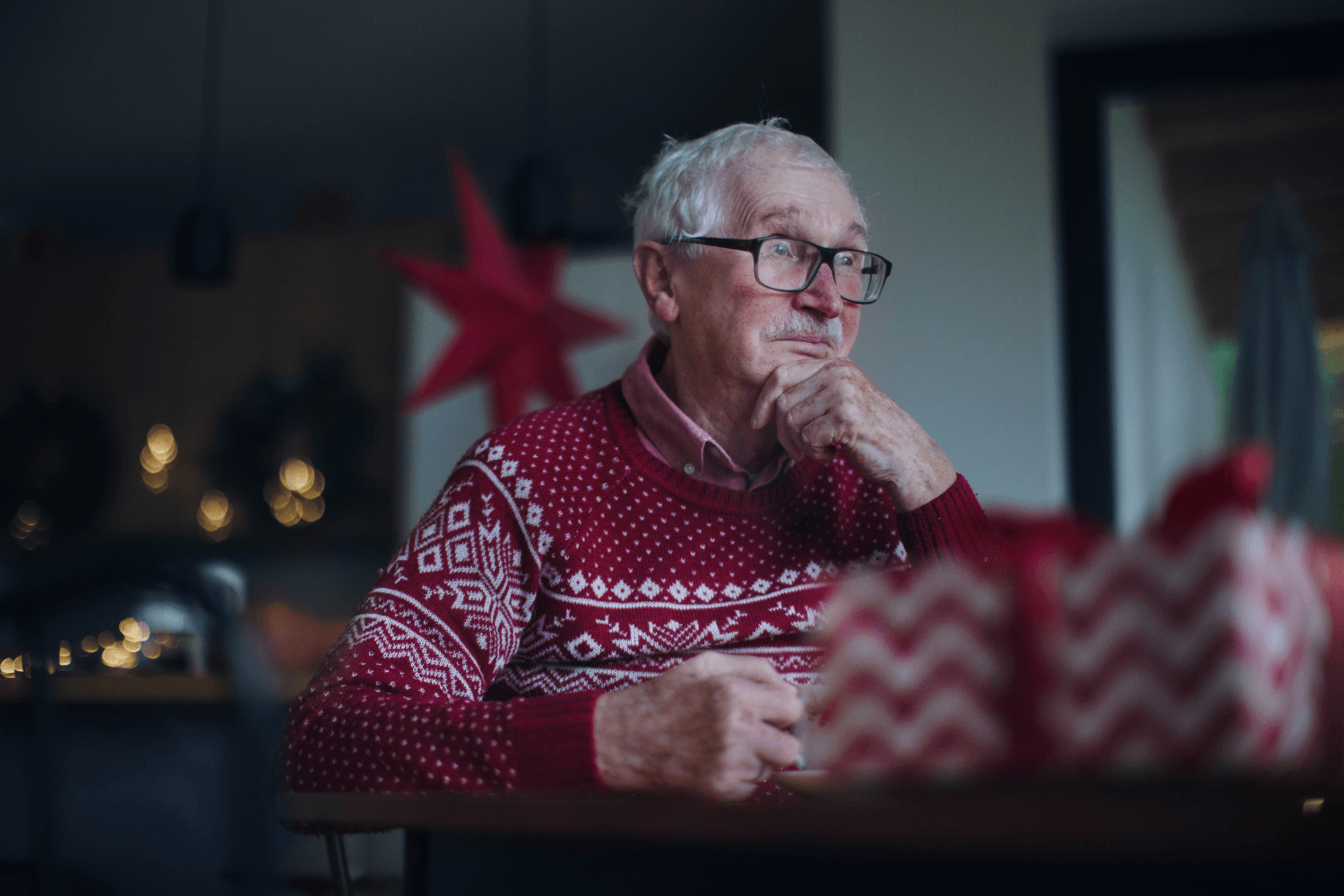Elderly man unhappy and alone during Christmas